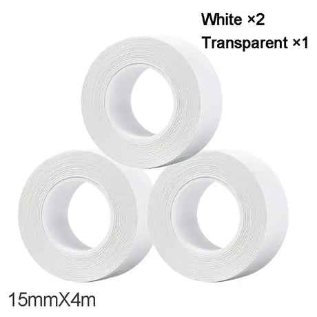 three rolls of white tape are stacked on top of each other