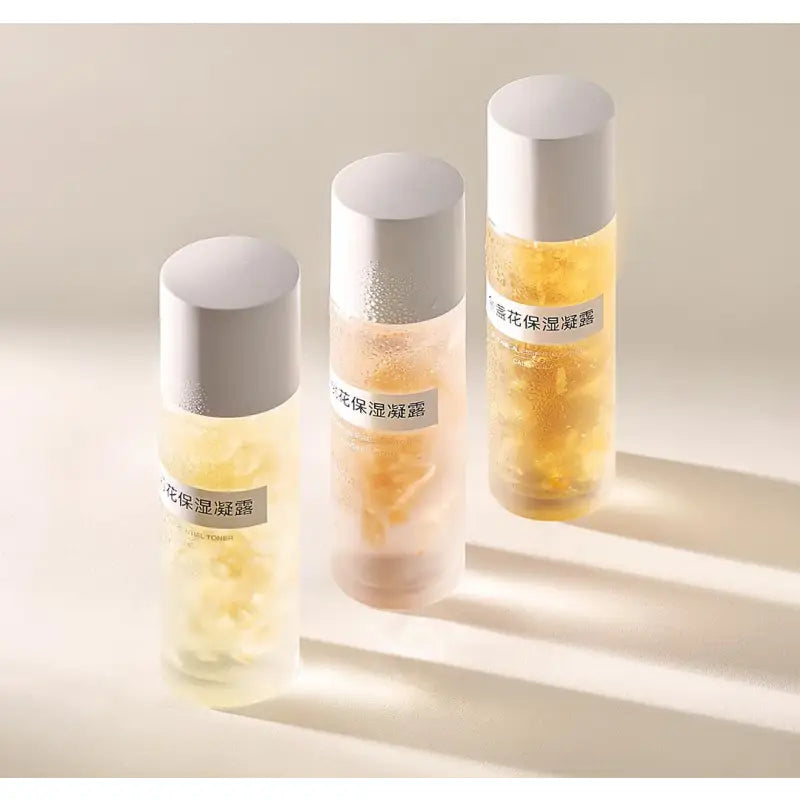 three bottles of perfumes with a white background