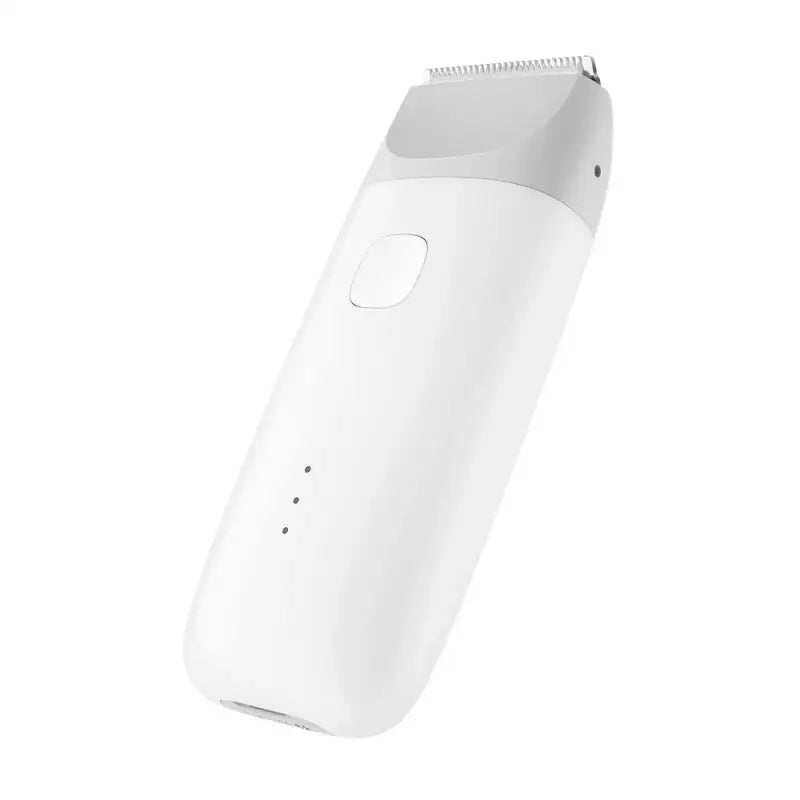 a close up of a white electric shaver on a white background