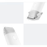 a close up of a white electric shaver with a white background