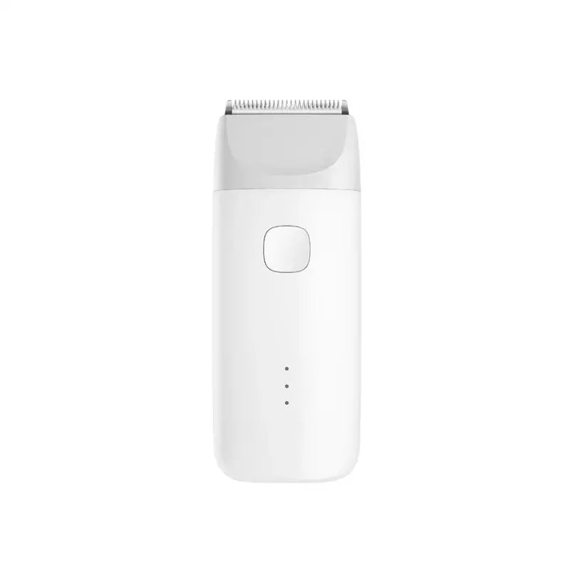a close up of a white electric shaver on a white surface