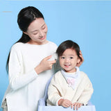 a woman and child are sitting on a blue background