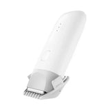 a close up of a white hair clipper with a white background