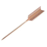 a gold colored metal arrow shaped object