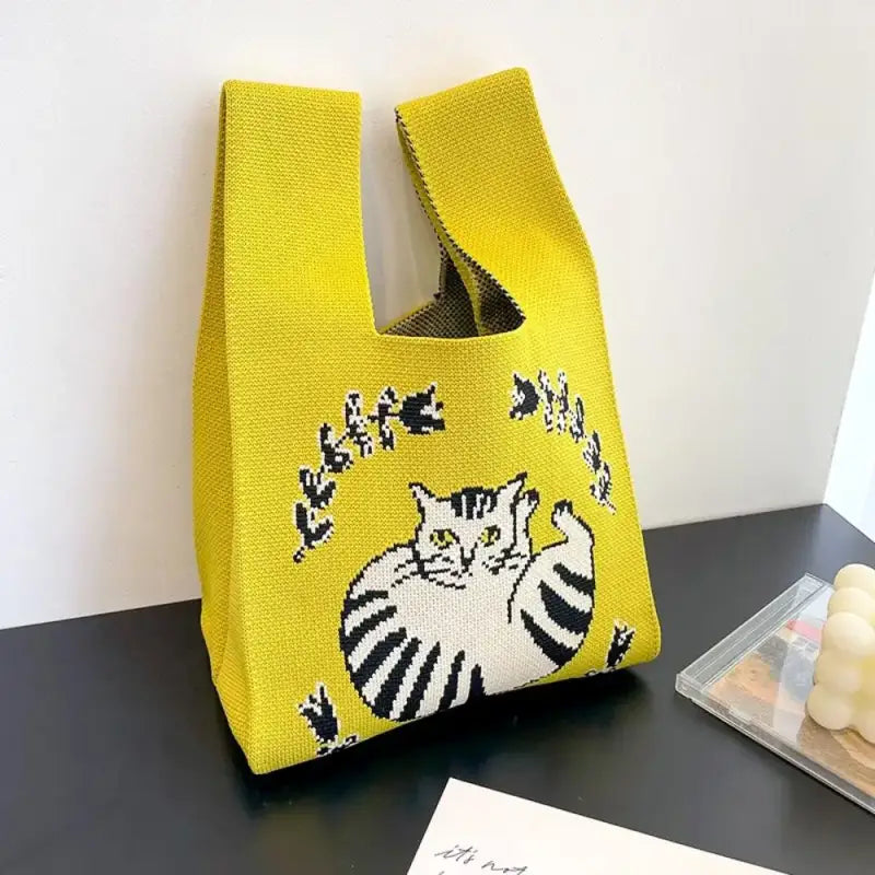 a yellow bag with a cat on it