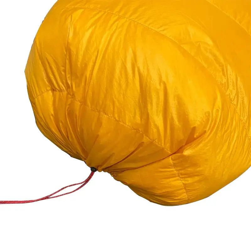 a yellow sleeping bag on a white background
