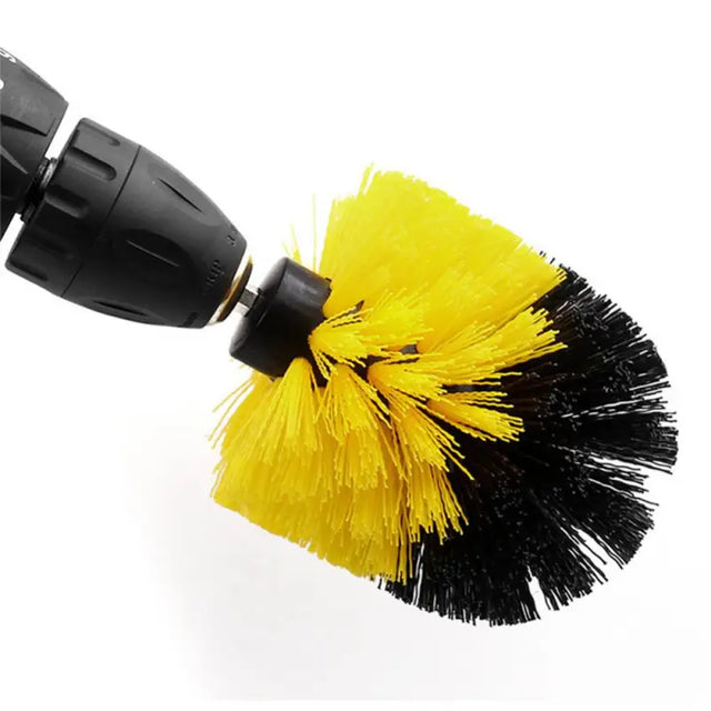 a yellow and black brush with a black handle