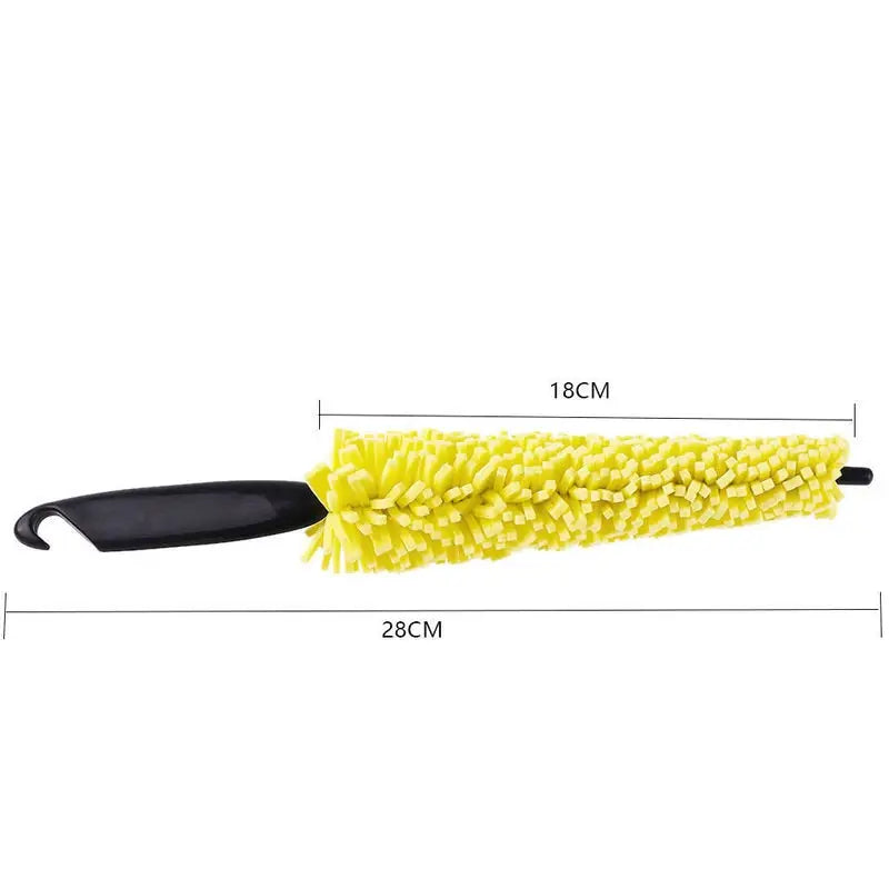a yellow chene brush with a black handle