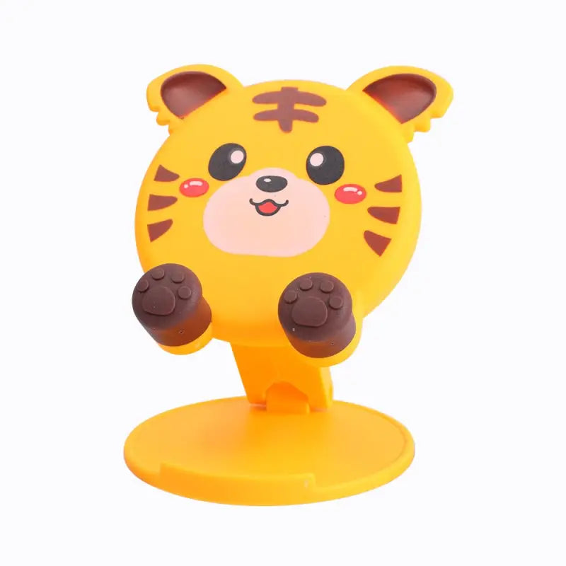 a yellow toy with a brown and black face