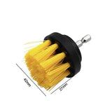 a yellow brush with a black handle