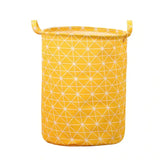 a yellow fabric storage bag with white geometric pattern