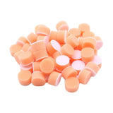 a pile of orange and white candy candys