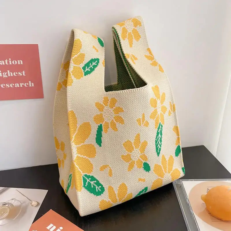 a yellow and green bag sitting on top of a table