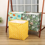 a yellow and green storage bag with a white and yellow fabric inside