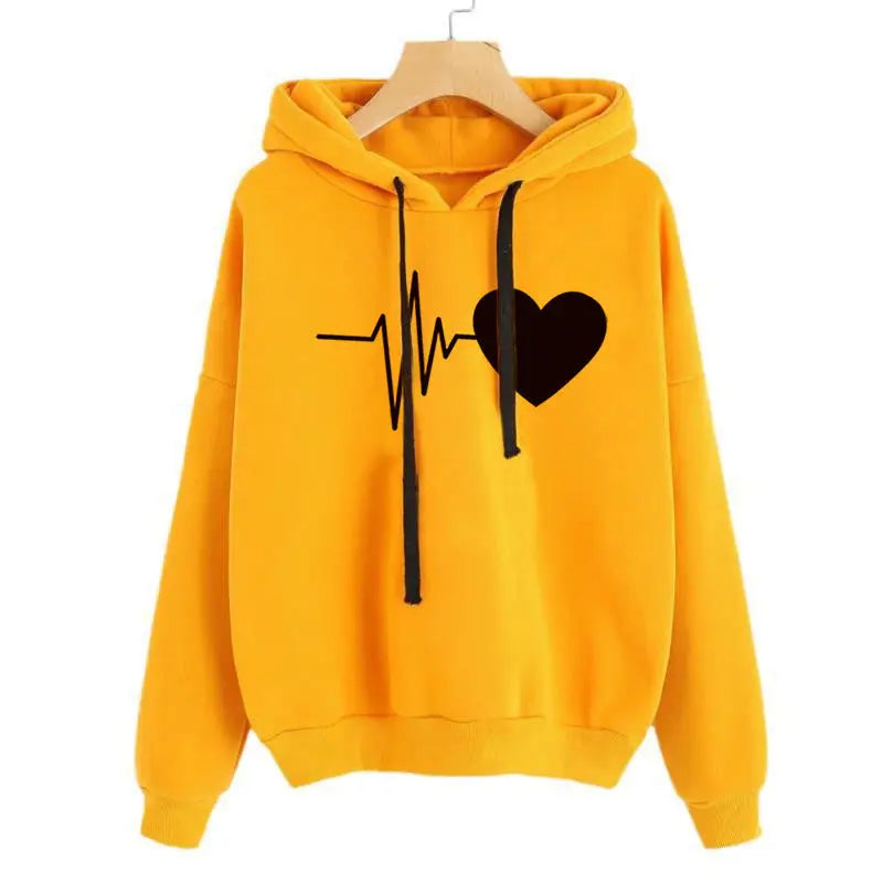 a yellow hoodie with a black heart on it