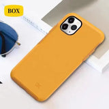 a yellow iphone case sitting on a white table