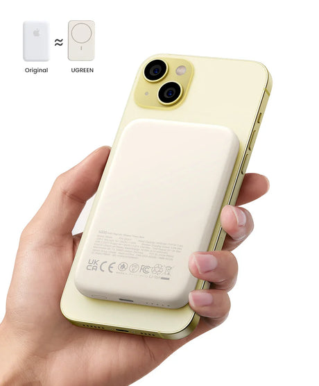 Yellow iPhone with a white battery pack attachment on its back.