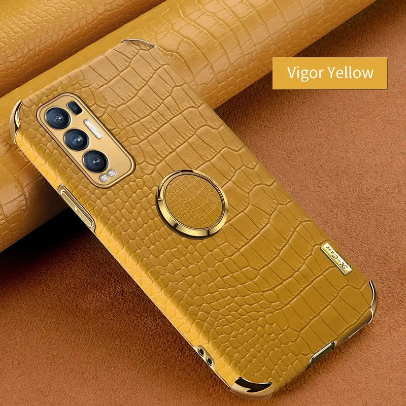 the back of a yellow leather case with a ring on it