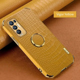 The back of a yellow leather case with a ring on it