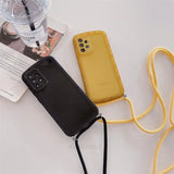 a yellow phone case with a black strap