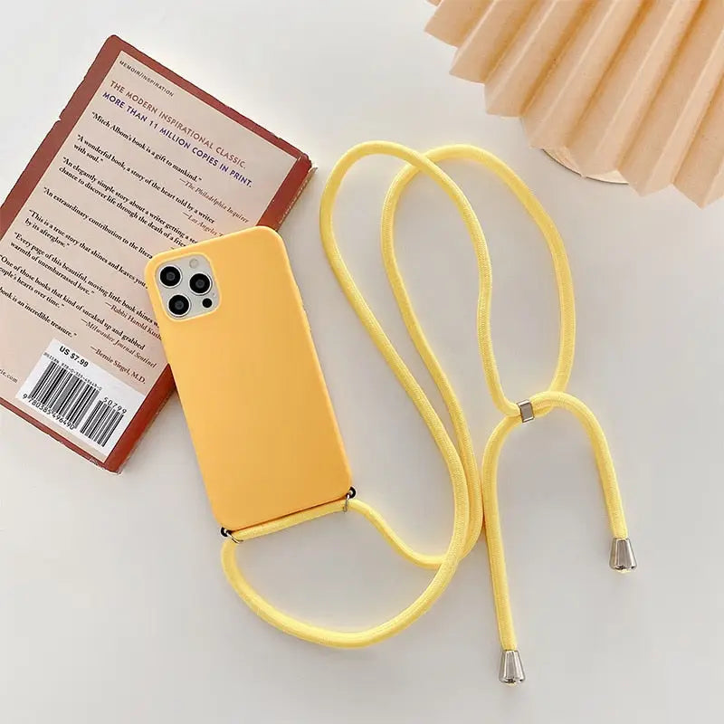 a yellow phone case with a cable attached to it