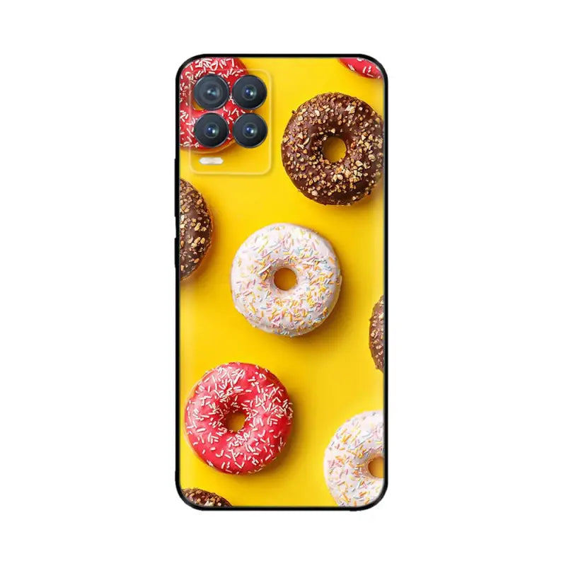 a yellow phone case with donuts on it