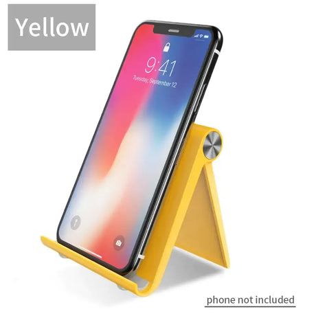 The yellow phone stand is shown with the phone in the background