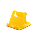 a yellow plastic phone stand