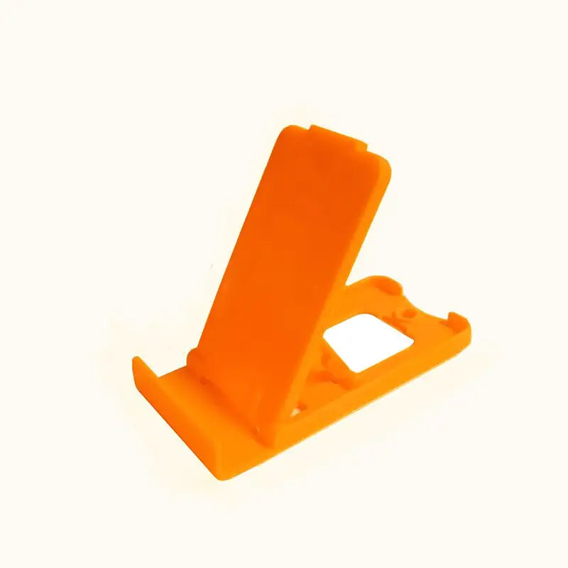 a orange phone stand on a white background
