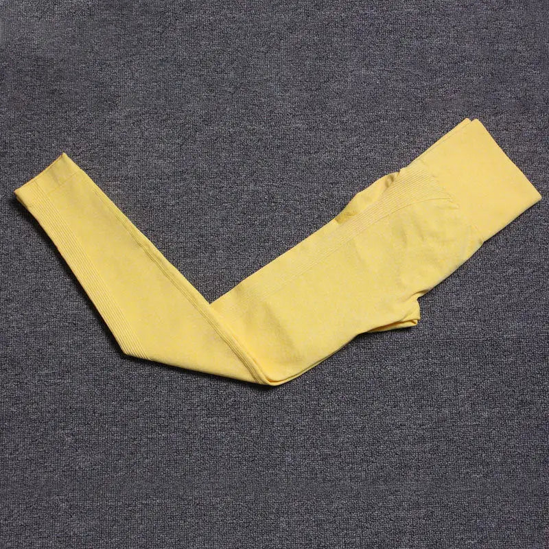 a piece of yellow fabric on a black background