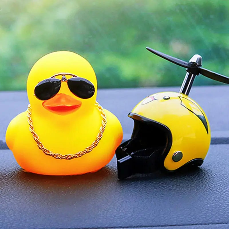 a yellow rubber duck with sunglasses and a helmet