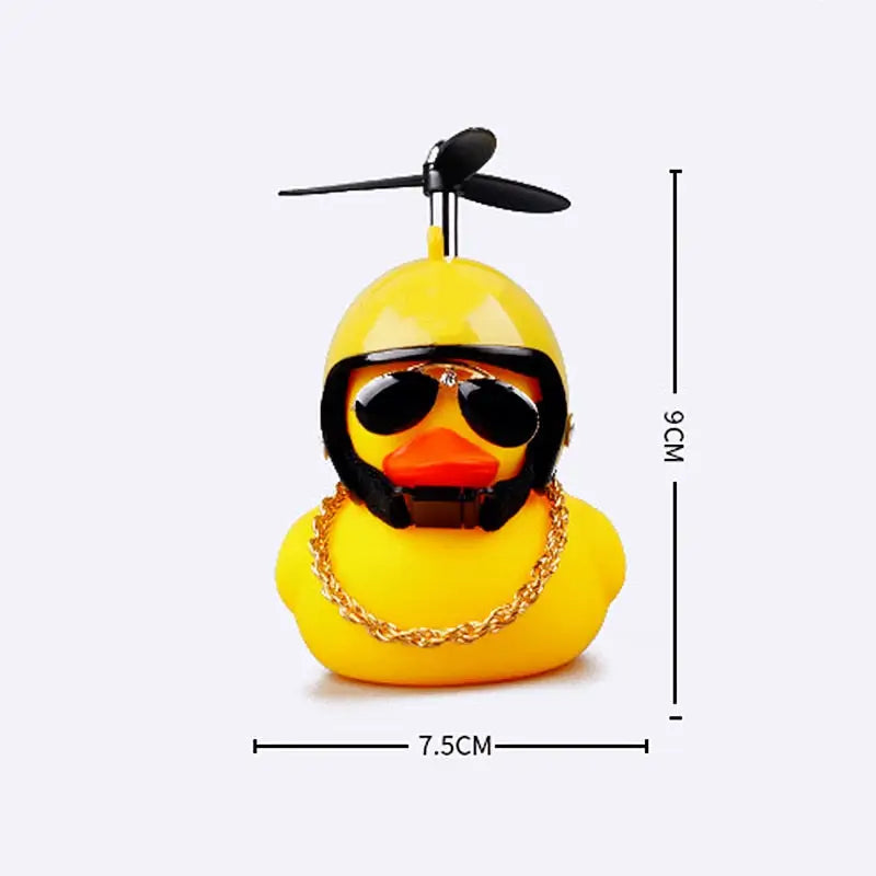 a yellow rubber duck with sunglasses and a chain