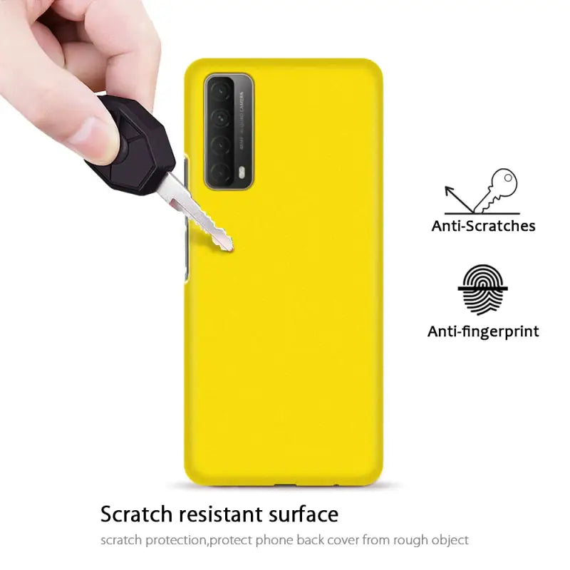 the back of a yellow samsung phone case with a key in it