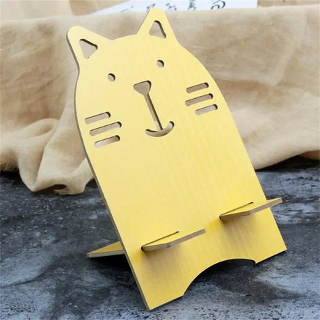 a cat shaped book stand with a yellow cat face