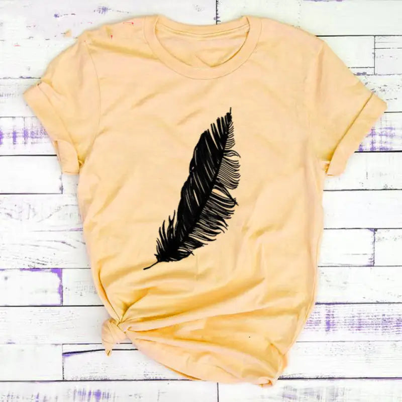 a yellow shirt with a black feather on it
