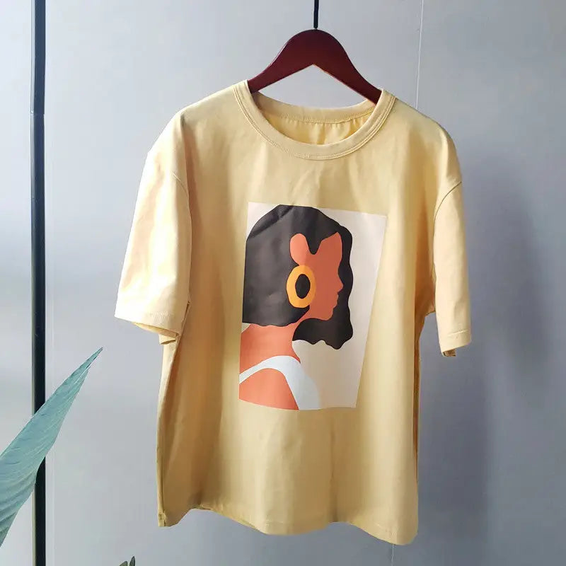 a yellow t - shirt hanging on a hanger