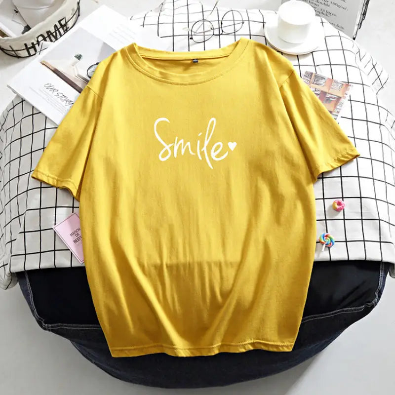 a yellow t shirt with the word’s on it