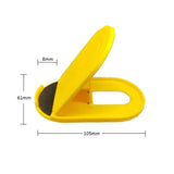 yellow plastic shoe clip with black rubber pad