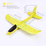 a yellow toy plane with a black propeller