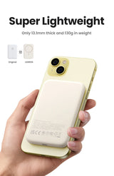 Yellow smartphone with a dual-camera system being held by a hand.