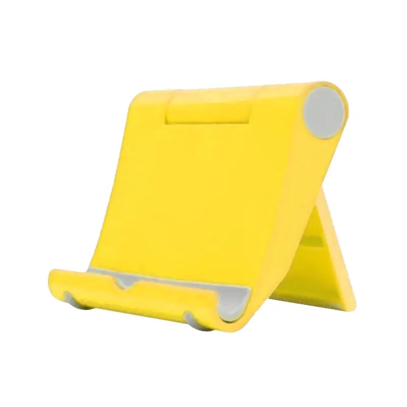 a yellow tablet stand with a white background