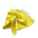 a yellow towel with a measuring line showing the width of it