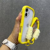 Yellow-trimmed phone case with fluffy wrist strap.