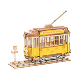 a yellow trolley car with a wooden roof