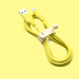 Yellow USB charging cable with a white cable organizer clip.