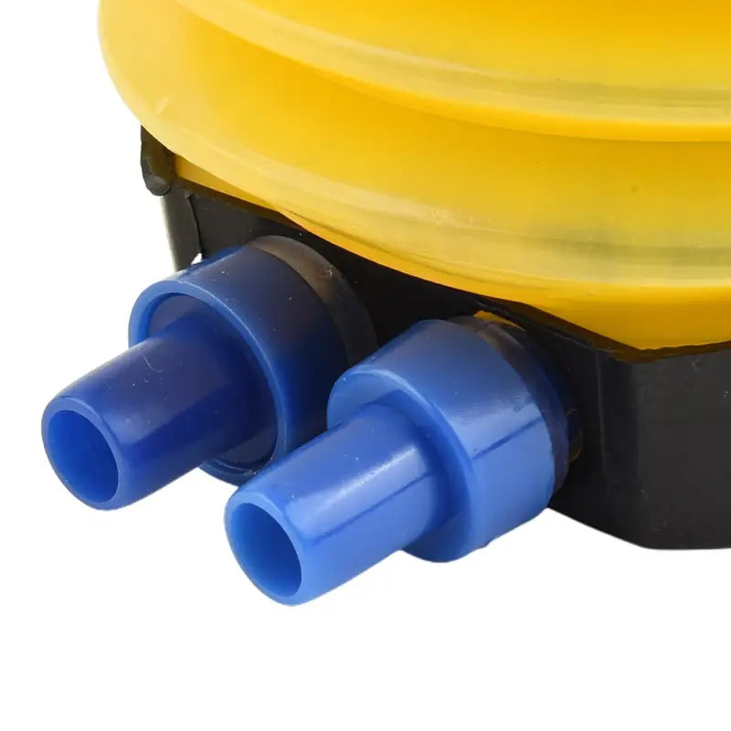 a yellow plastic water bottle with two blue plastic caps
