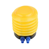 a yellow plastic push button with blue plastic push button