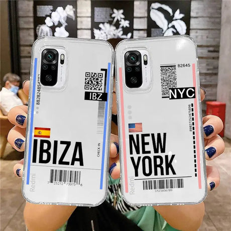 a woman holding up two new york phone cases
