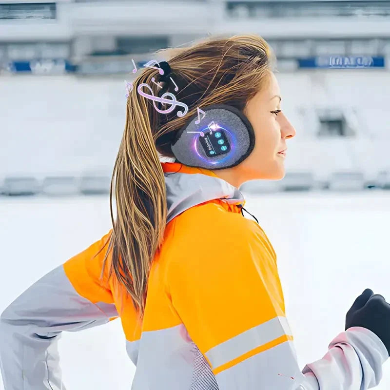 a young girl wearing headphones on her ski board