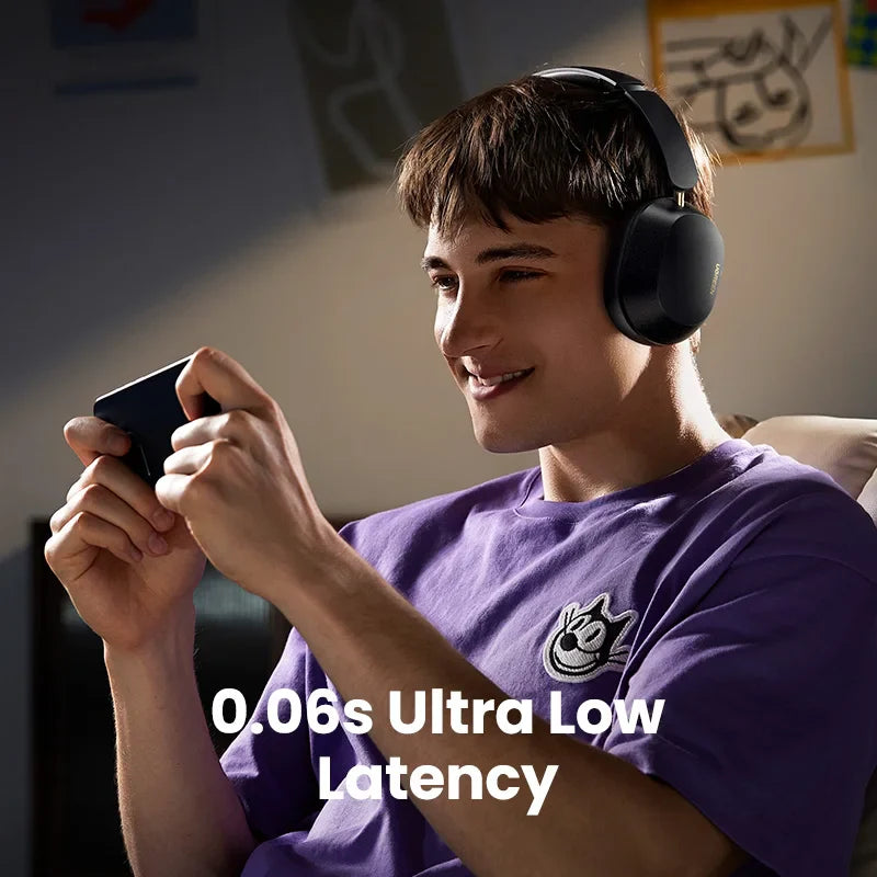 Smiling young person wearing headphones and holding a gaming controller.